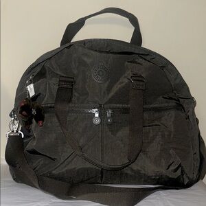 Kipling Black Duffel Bag, new, outside pockets, inside pockets, unisex